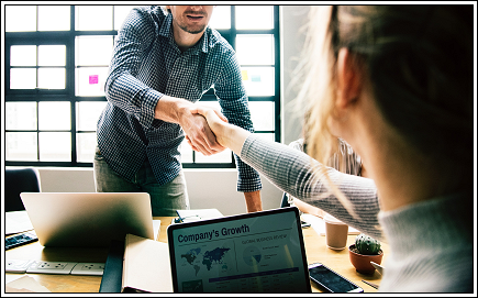 IT Support Tech shaking hands with a customer